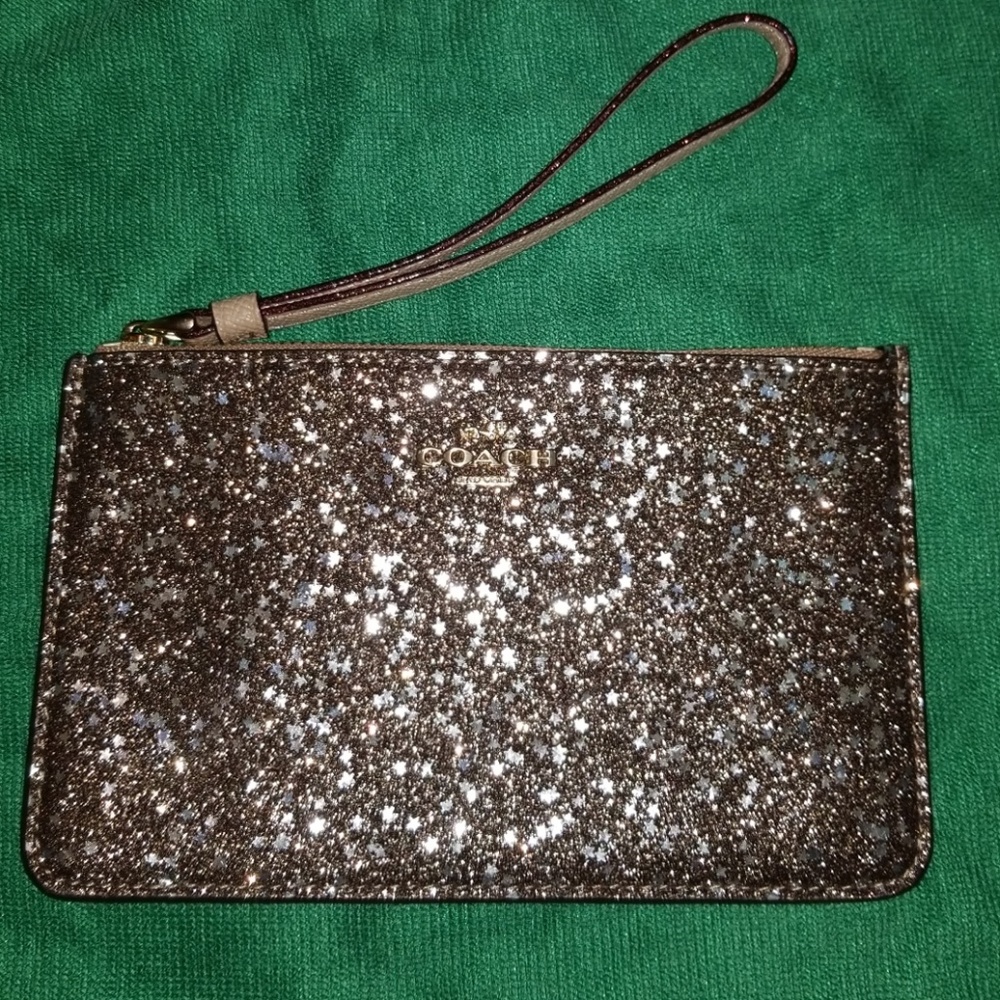 Coach star glitter sparkle wristlet gold